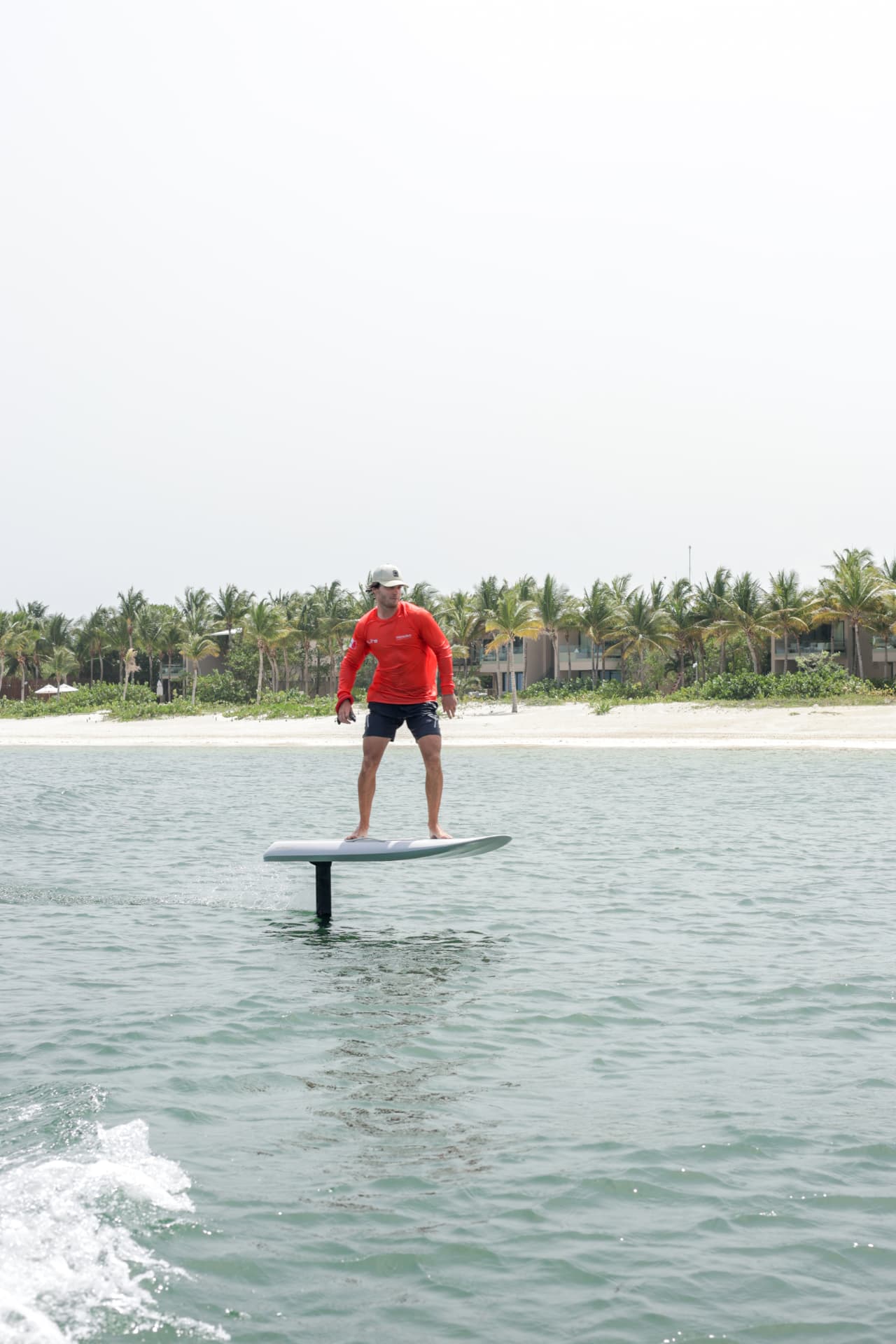 Caribbean Efoil instructor in flight above the calm Mayakoba lagoon