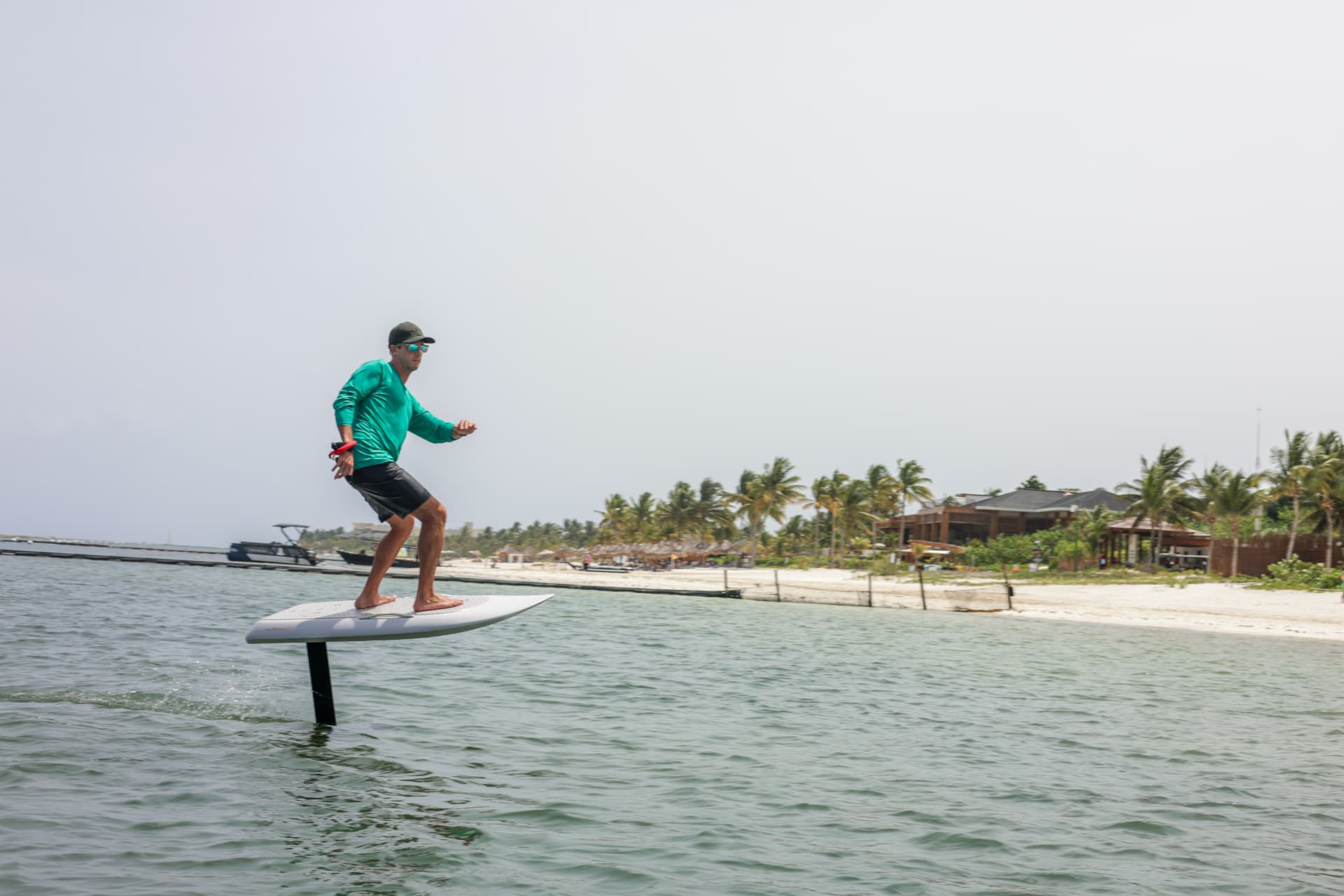 Rider carving on a Fliteboard on the calm Caribbean water at Mayakoba