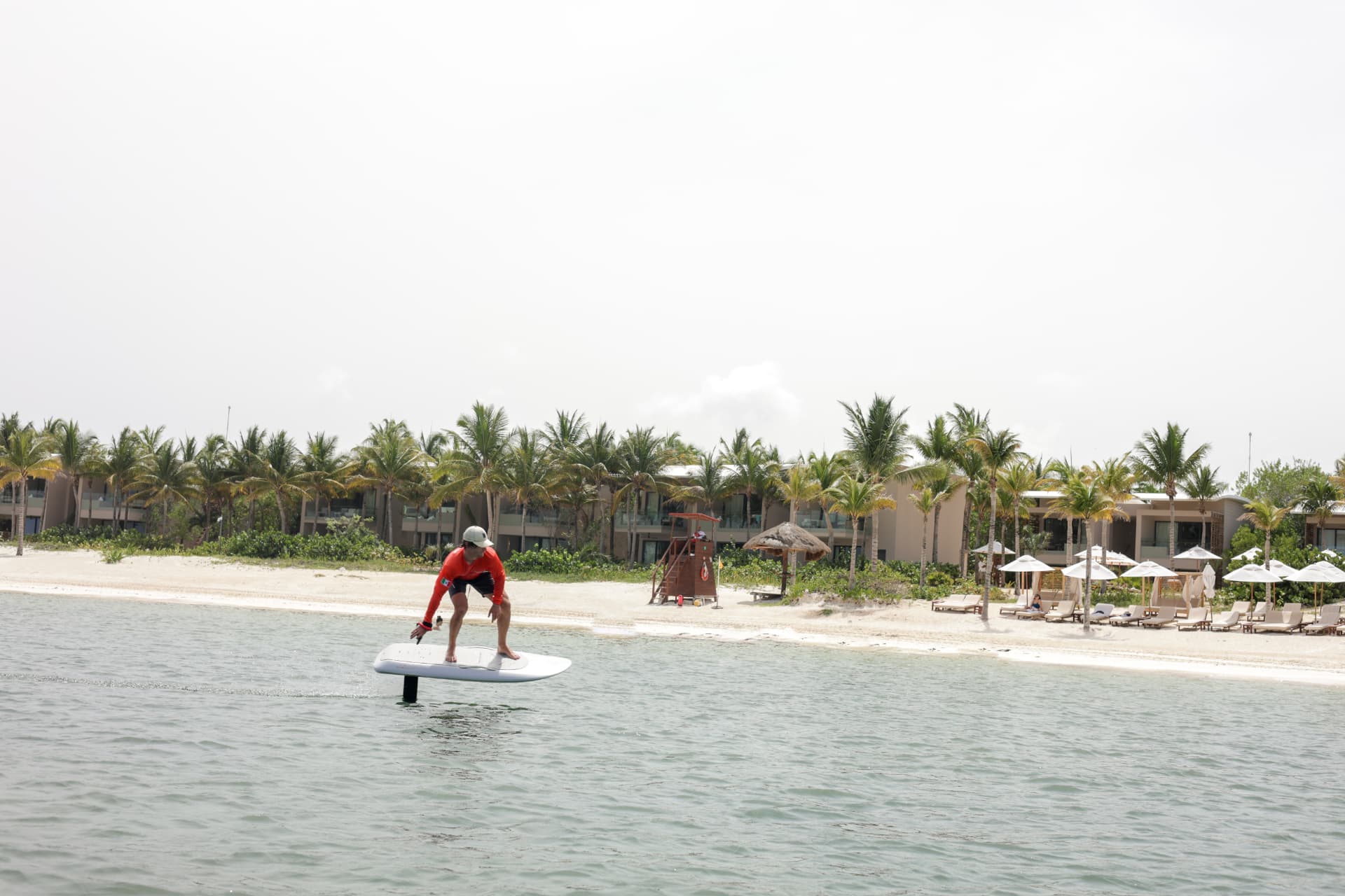 Rider taking off on a Fliteboard beside the Mayakoba beach